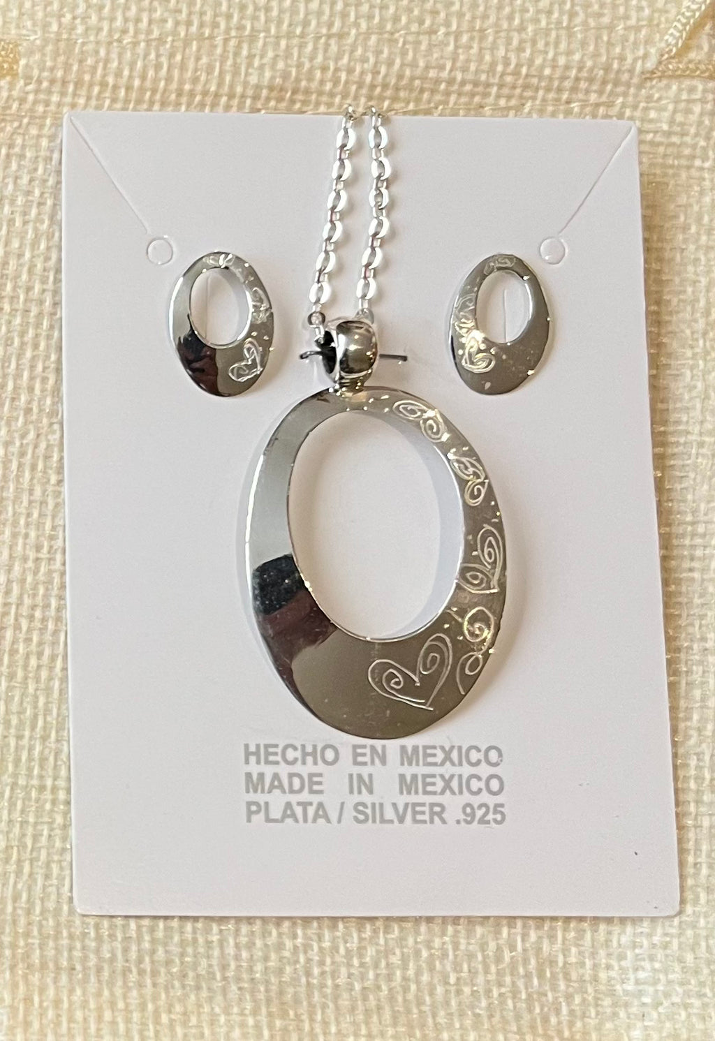 Juego de aretes y dije plata .925